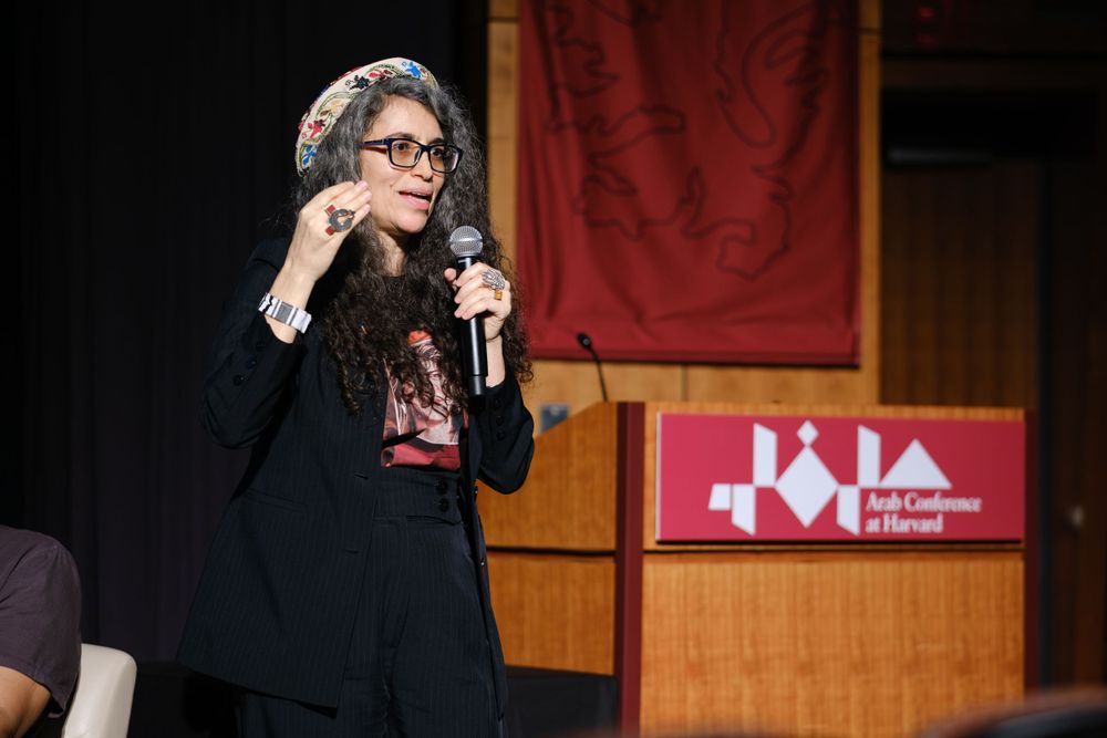 Conference speaker presenting with a handheld microphone