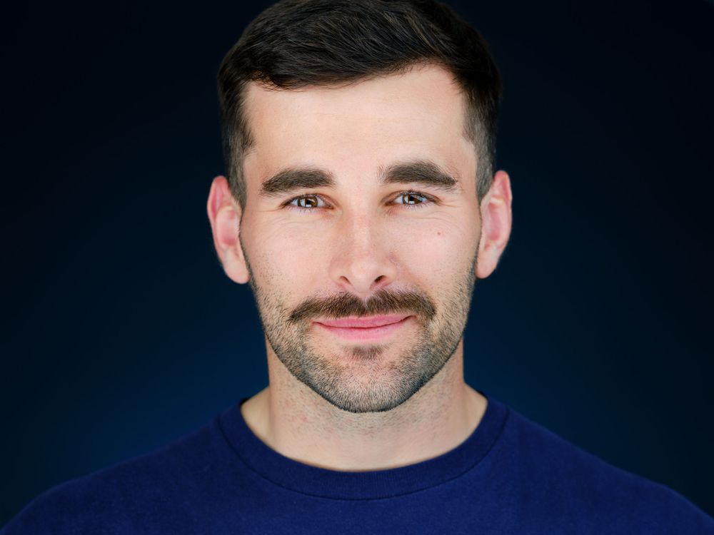 Professional guest headshot on a blue background